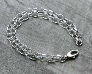 Layered silver charm bracelet