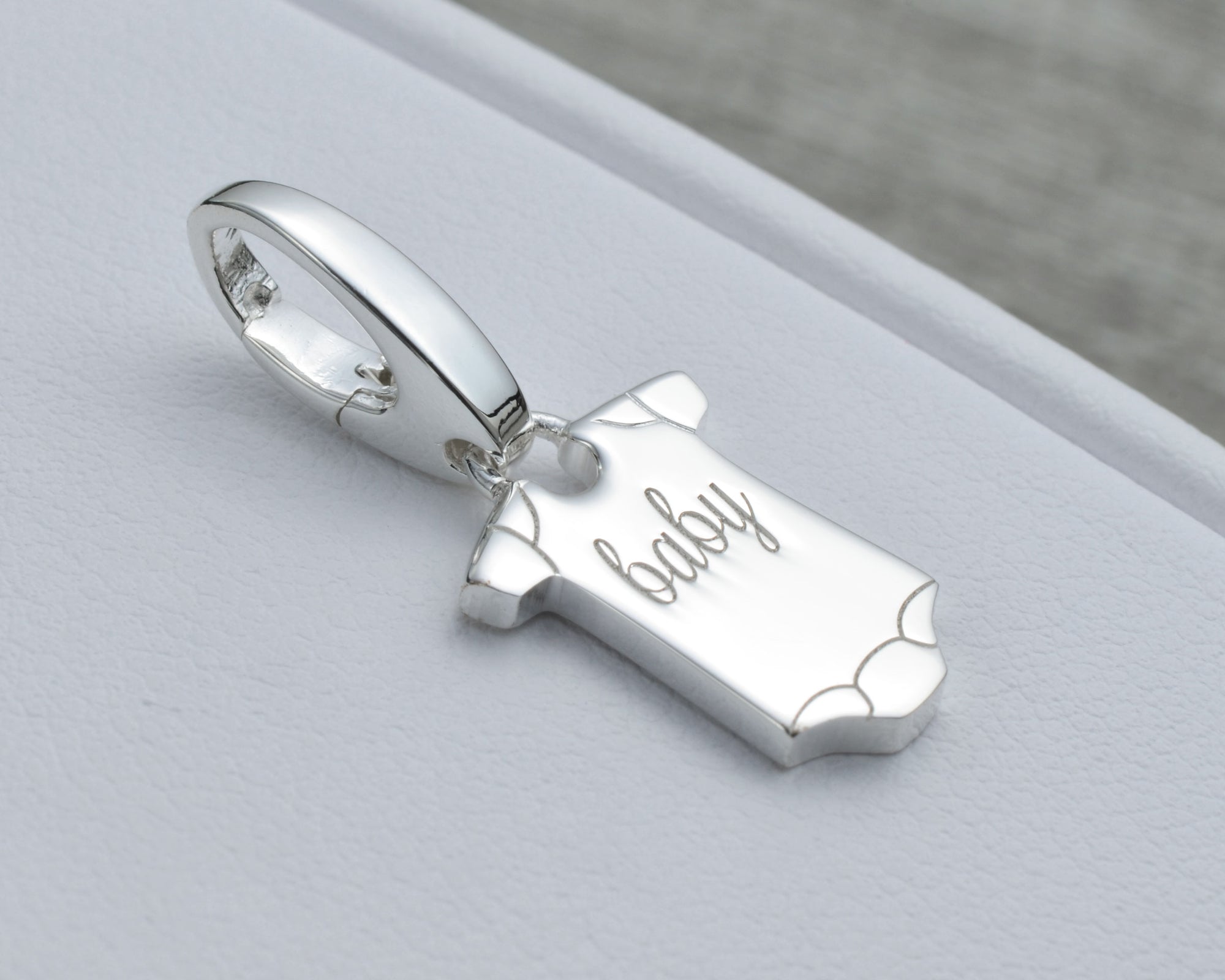 BABY CHARM IN STERLING SILVER