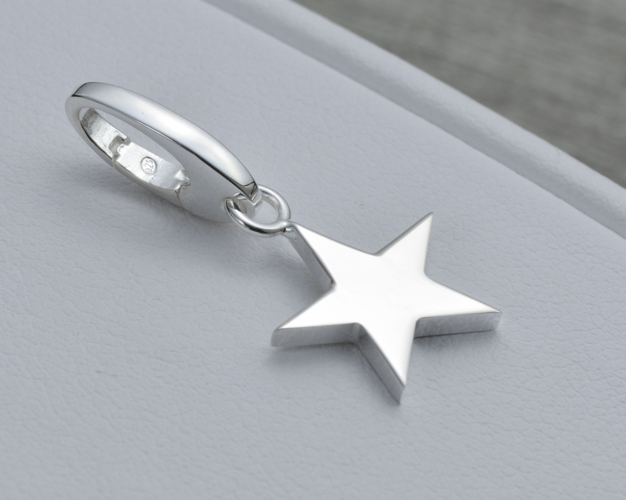 STAR CHARM IN STERLING SILVER