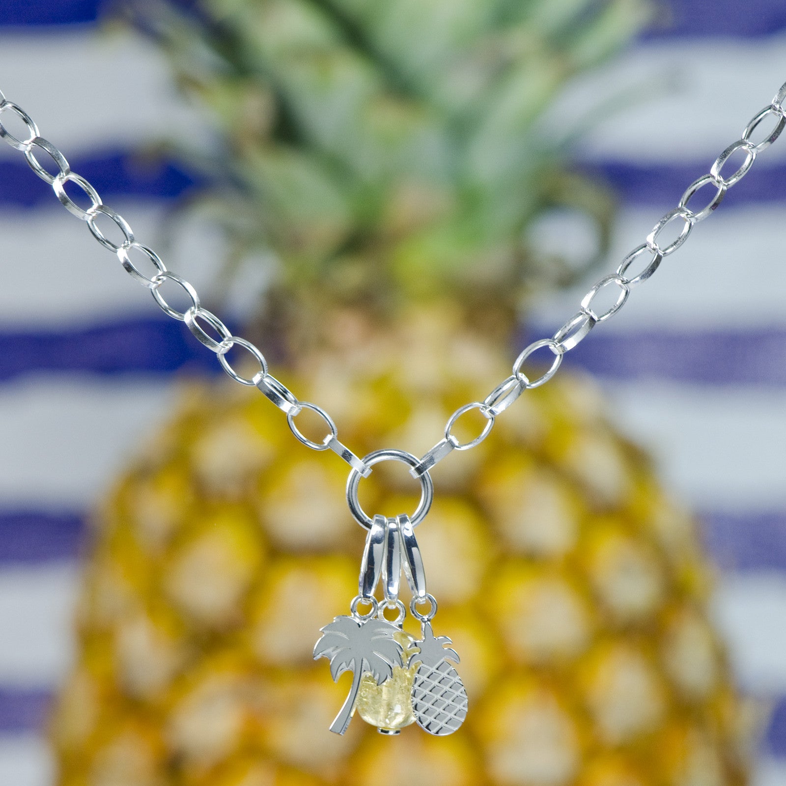 Sterling silver charm necklace with sterling silver palm tree charm, yellow citrine gemstone charm and sterling silver pineapple charm