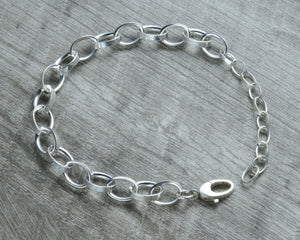 STERLING SILVER CHARM BRACELET WITH EXTENDER