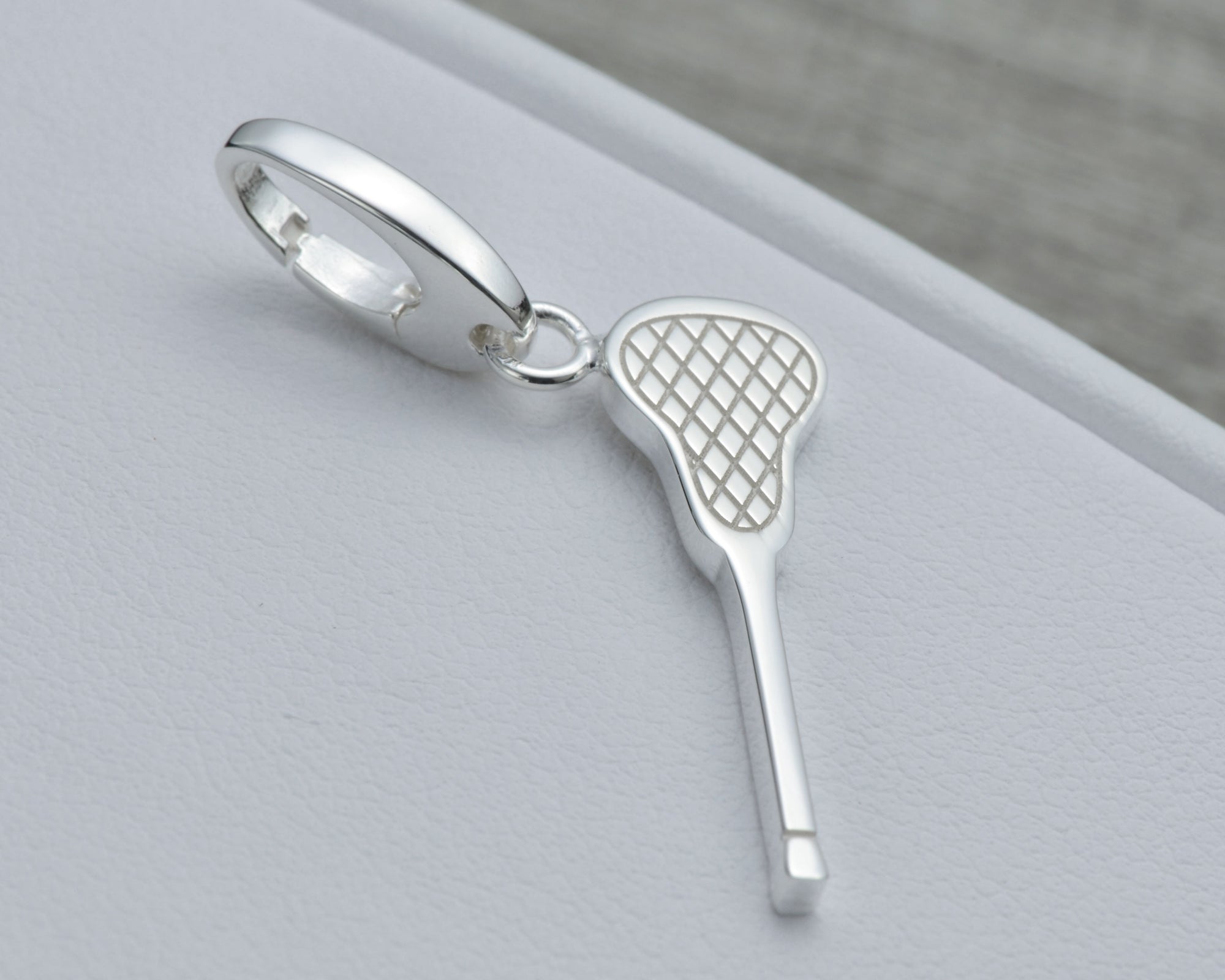 LACROSSE CHARM IN STERLING SILVER