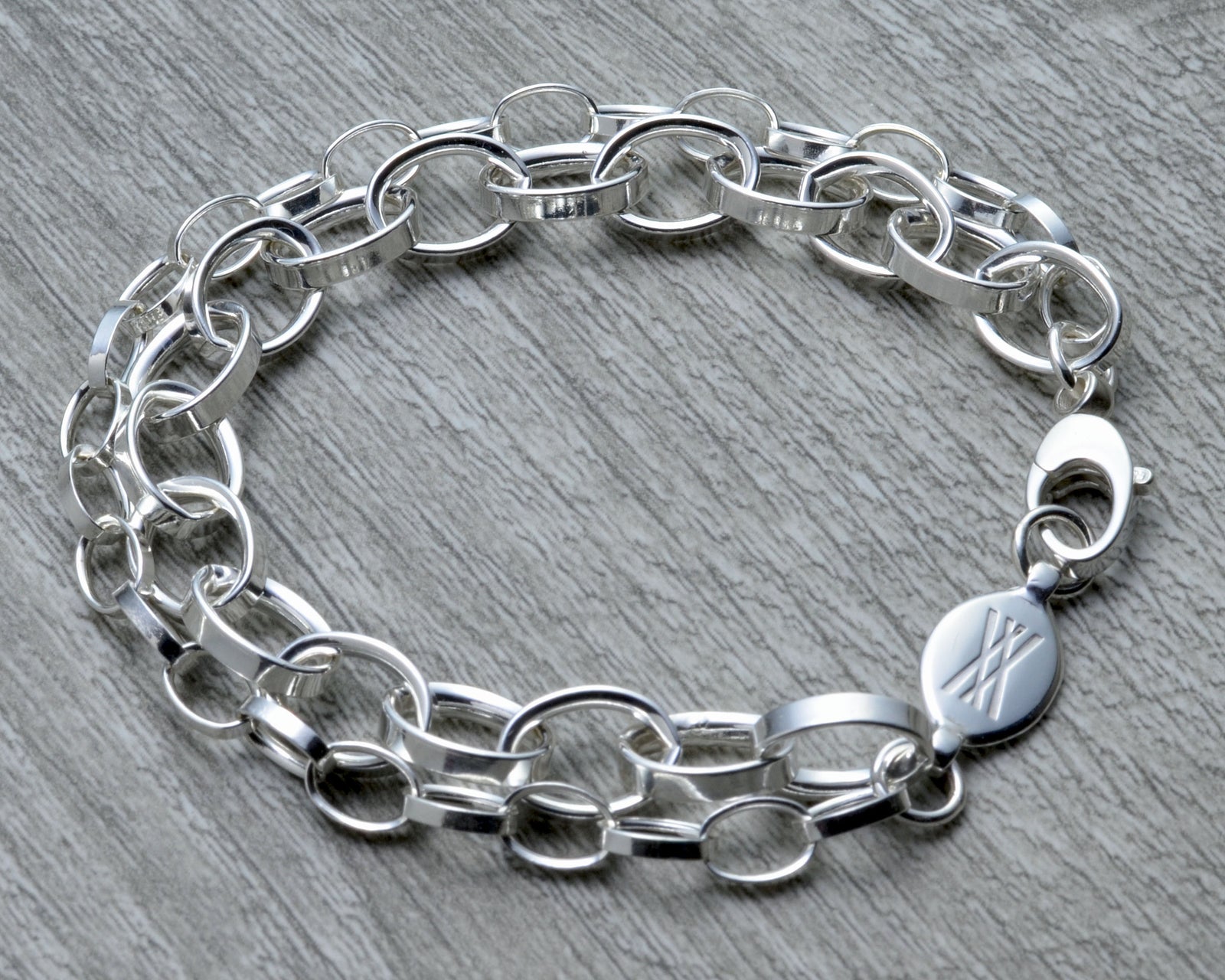 LAYERED CHUNKY SILVER CHARM BRACELET