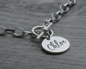 Toggle choker name tag