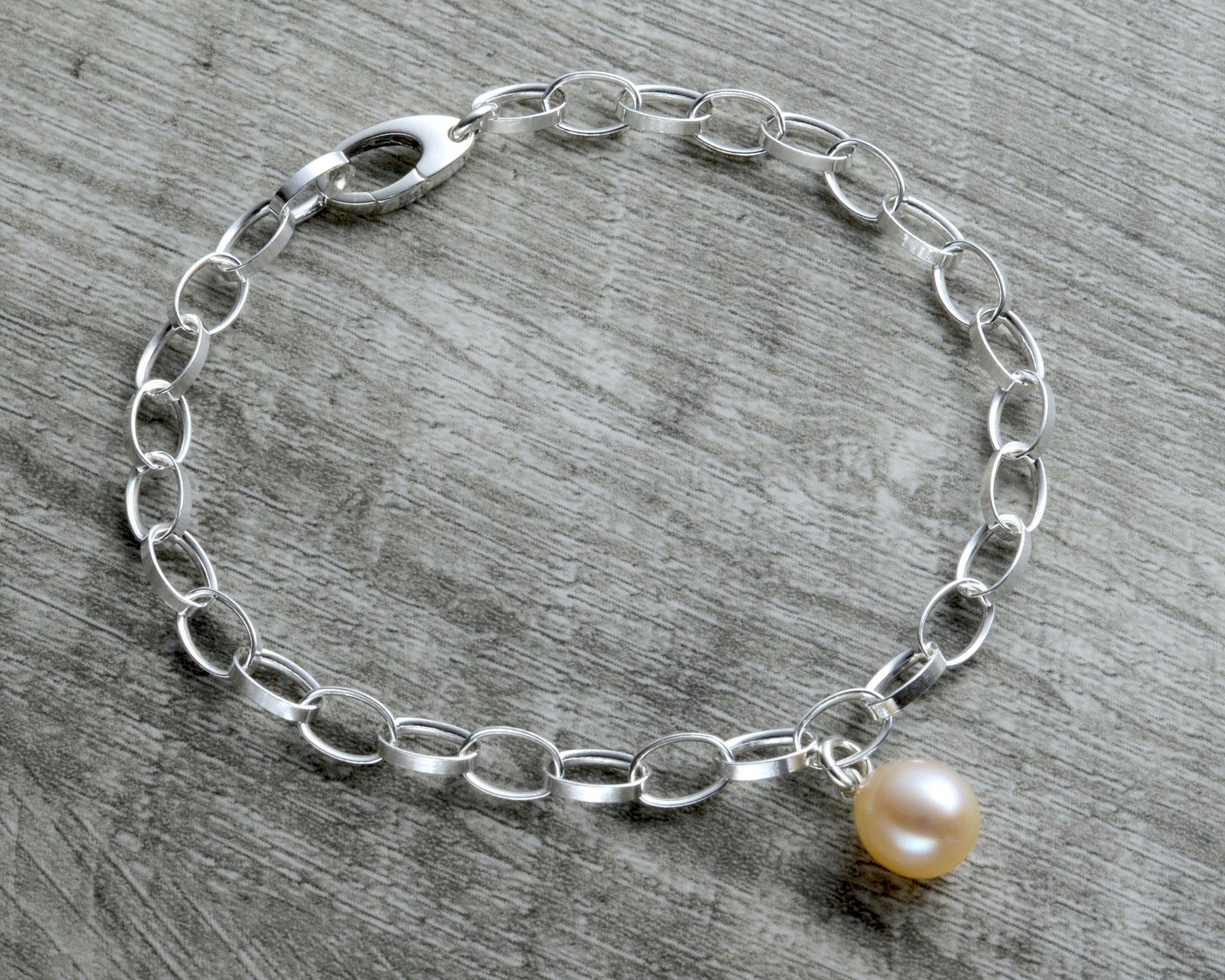 charm bracelet in sterling silver with pearl pendant