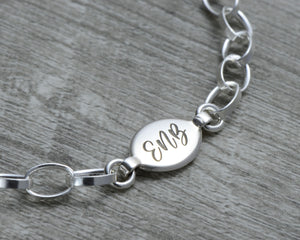 engraved initial tag in sterling silver for charm bracelet