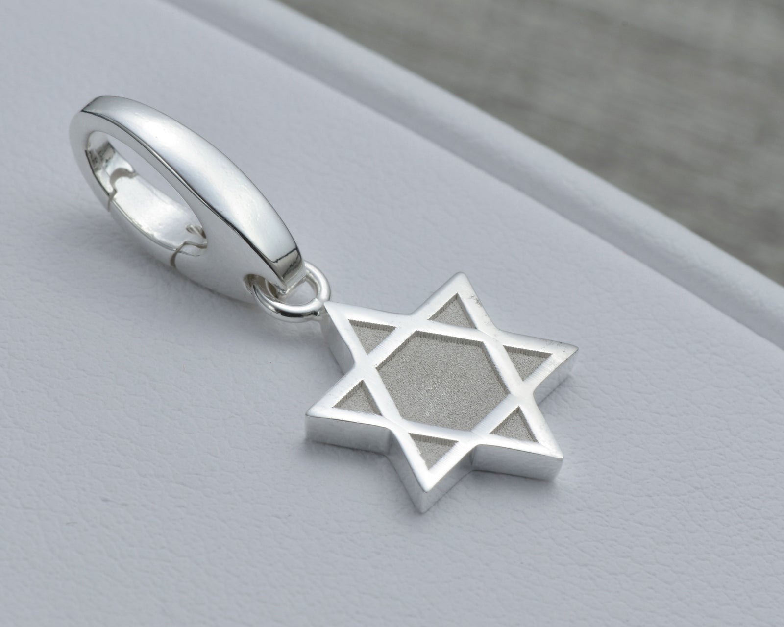 STAR OF DAVID CHARM IN STERLING SILVER